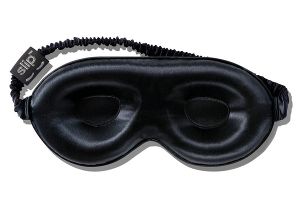 A Slip Silk Contour Sleep Mask by Slip with an adjustable elastic strap and branded tag on the left side, perfect for beauty sleep.