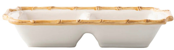 A ceramic double serving dish shaped like a bamboo stalk, featuring two compartments and a naturalistic bamboo rim, the Juliska Bamboo Two Section Server.