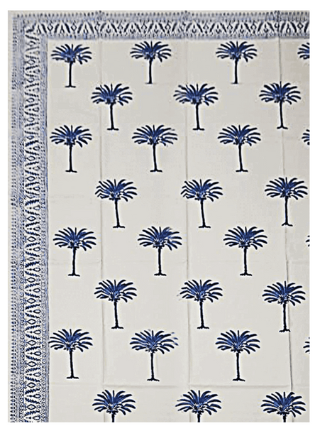 Blue Les Ottomans Cotton Tablecloth with Palm tree patterns on a white tablecloth with decorative border.