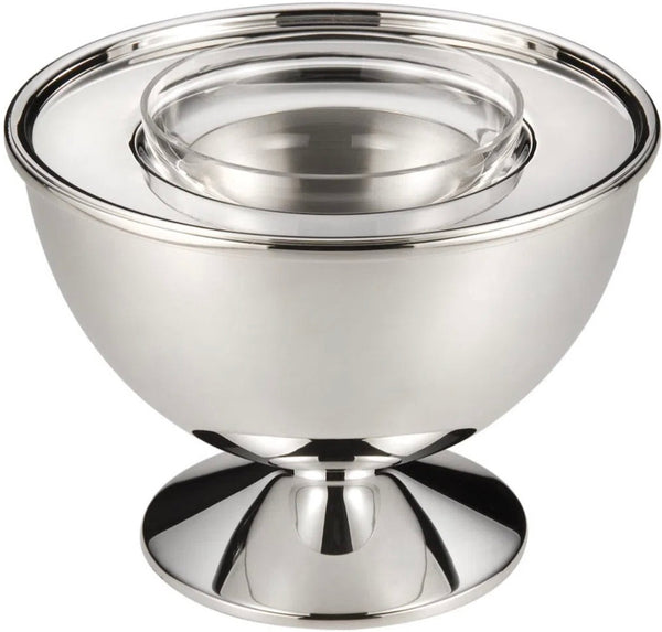 A St. James Porto Vienna Caviar Cooler with a pedestal base, featuring a smaller, removable crystal bowl nestled inside, exemplifies Baba Vacaro's craftsmanship.