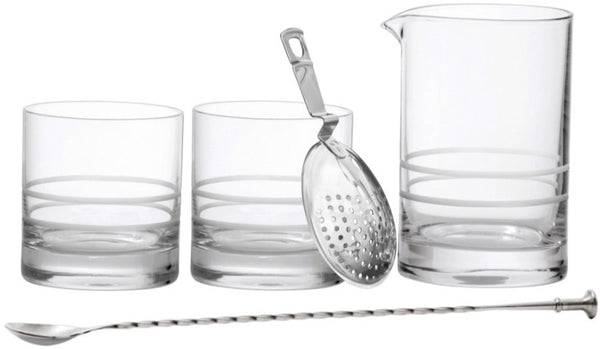 The Fortessa Crafthouse 5-Piece Mixing Set includes two short glasses, one tall pitcher with a spout, a metal strainer, and a long stirrer spoon—perfect for any home bartender's barware collection.