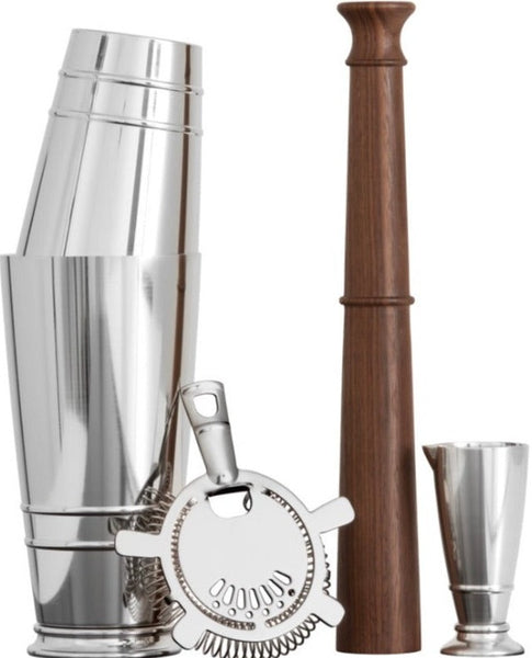 A Fortessa Crafthouse Shaker Set by Fortessa, including a shaker, strainer, jigger, and wooden muddler, is arranged upright against a white background in a neat V-shape formation.