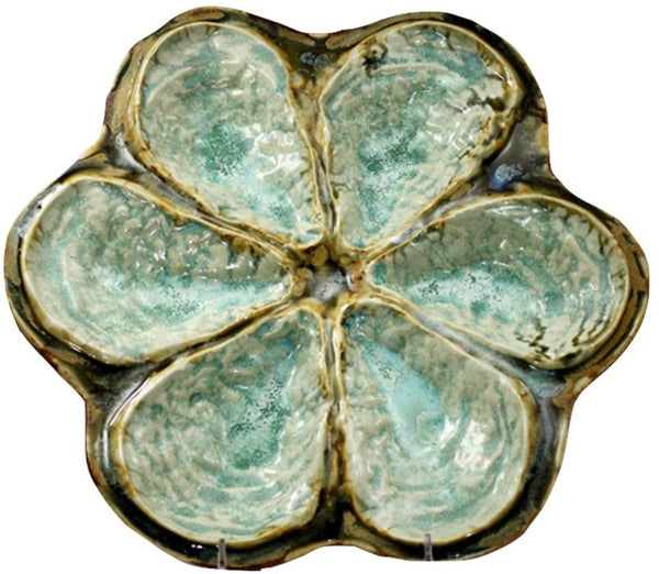 An AE Ceramics Oyster Platter for 6 Oysters with six petal-shaped sections, glazed in shades of green and brown, reminiscent of a classic Oyster platter, viewed from above.