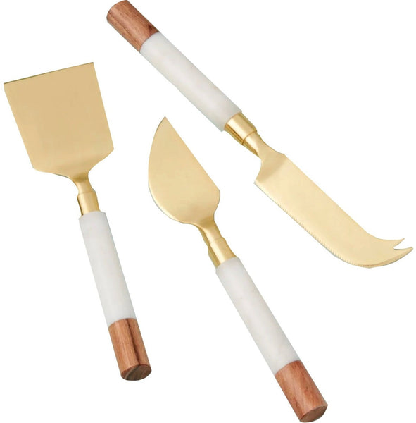 The Be Home White Marble & Acacia Gold Cheese Set of 3 by Be Home features three knives with gold blades and handles of white and wooden segments. The set includes a flat spreader, a pointed knife, and a dual-pronged cheese knife, perfect for pairing with your favorite serving boards.