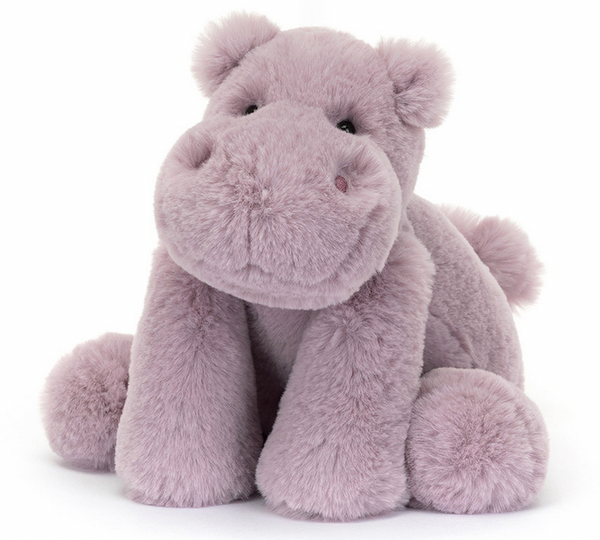 A Jellycat Smudge Hippo sits upright, made of soft lilac fur with a round face and small ears. This adorable hippopotamus makes a great gift for any occasion.