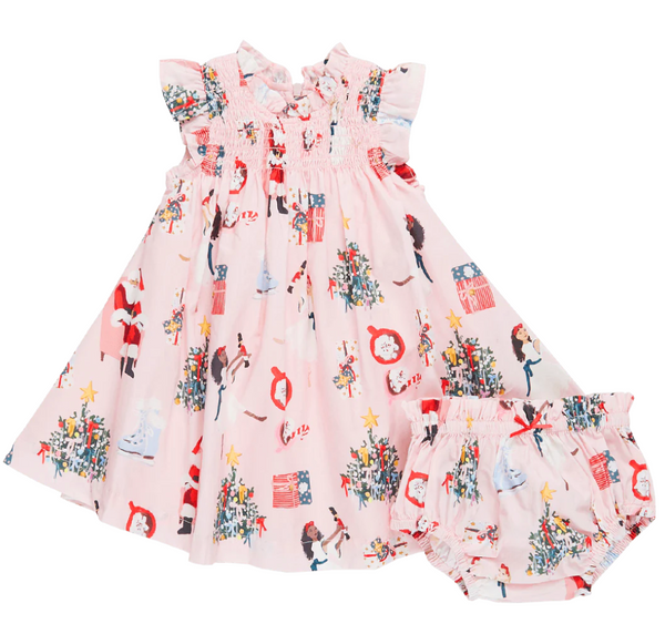 The Pink Chicken Baby Girl Stevie Dress is a pink delight with festive Christmas prints, featuring smocking at the chest and an elastic waist diaper cover for added comfort.