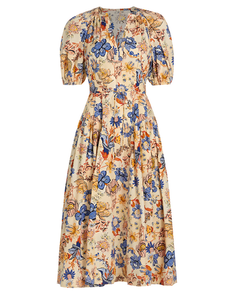 The Ulla Johnson Carina Magnolia Dress by Ulla Johnson boasts an elegant, ankle-length white design with short puffed sleeves and a multicolored floral pattern in blue, yellow, and orange shades. Its sophisticated look is further enhanced by an A-line skirt.