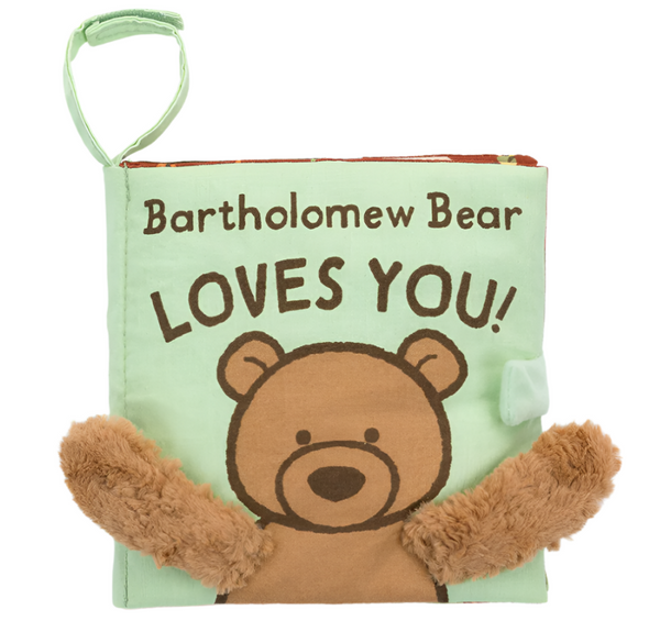 The Jellycat Bartholomew Bear Loves You Book by Jellycat is a soft green cloth children's book featuring an illustration of Bartholomew Bear, text that reads "Bartholomew Bear LOVES YOU!" and tactile fabric bear paws attached to the cover.