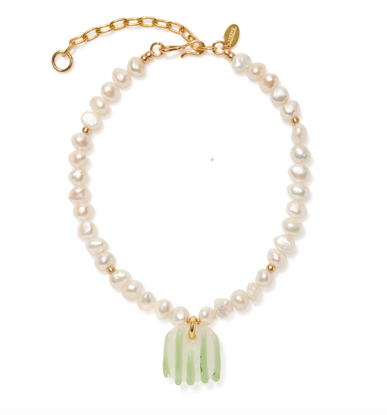 Introducing the Lizzie Fortunato Marine Glass Necklace by Lizzie Fortunato, a stunning freshwater pearl necklace featuring irregular white pearls, small gold beads, and a gold chain clasp. The centerpiece is a handmade glass pendant with a fringe design, secured by a gold loop. This exquisite piece is further enhanced with elegant gold-plated accents for an added touch of sophistication.