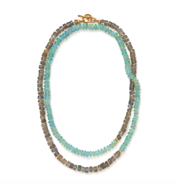 The Lizzie Fortunato Sea Grass Necklace by Lizzie Fortunato showcases an exquisite design with alternating teal and grey stones, complemented by labradorite accents, and finished with a gold clasp.