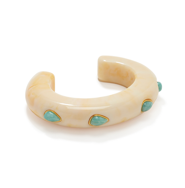 The Lizzie Fortunato Ridge Cuff with Stones is a beige, crescent-shaped bracelet featuring gold-framed turquoise and mother-of-pearl stones.