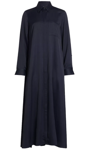 The TWP Jenny's Coated Linen Gown by TWP is a full-length, navy blue long sleeve shirtdress featuring a point collar, front button closure, and a single chest pocket.