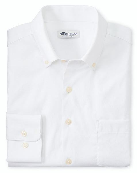 Folded white Collins Performance Oxford Sport Shirt with a front pocket. The label reads "Peter Millar," emphasizing its performance style and moisture-wicking capabilities.