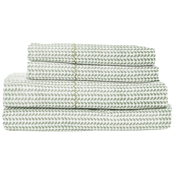 A stacked set from the John Robshaw Cinde Sage Bedding Collection, featuring bed sheets adorned with a green leaf pattern on a white background. These sheets are crafted from 200 thread count cotton percale for ultimate comfort and include delicate hand embroidery along the edges. Produced by John Robshaw, this organic sheet set offers both luxury and style.