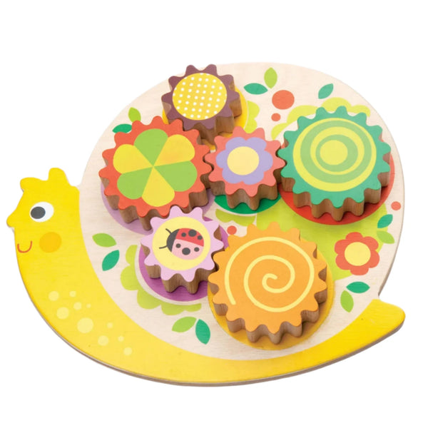 Introducing the Tender Leaf Snail Whirls by Tender Leaf Toys—a lively wooden puzzle set on a snail base with detachable, rotating cogs. Each cog is decorated with distinctive patterns and includes a delightful ladybug motif on one gear, making it ideal for developing fine motor skills in young children.