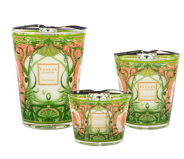 The Baobab Collection Tomorrowland Candle set features three decorative candles of varying sizes, adorned with floral patterns in green, pink, and orange hues that exude an Art Nouveau elegance. The intricate designs capture the essence of pear lily of the valley moss, subtly fragrancing your space with an enchanting nod to Tomorrowland.