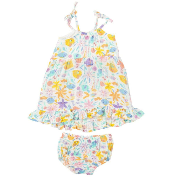 The Angel Dear Twirly Tank Dress for children comes with matching bloomers and features a beautiful floral design with colorful flowers and leaves on a white background. It is crafted from 100% organic cotton muslin, ensuring exceptional comfort and breathability. For best care, wash cold.