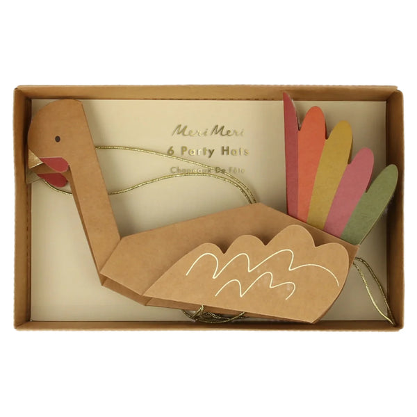 Box containing a set of six colorful turkey hats with vibrant tail feathers and gold string, labeled "Meri Meri Turkey Hats," sure to delight your party guests this Thanksgiving.