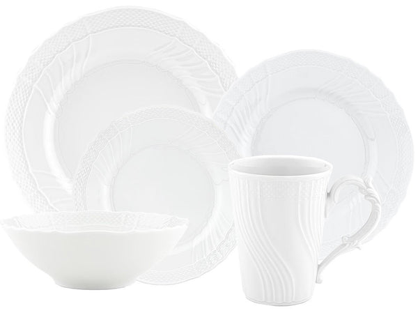 A set from the Ginori 1735 Vecchio White Collection, featuring Saxon-style white porcelain tableware that includes two plates, a bowl, and a mug, all adorned with a textured embossed pattern along the edges. Perfectly complemented by the exquisite detailing characteristic of Ginori 1735 porcelain.