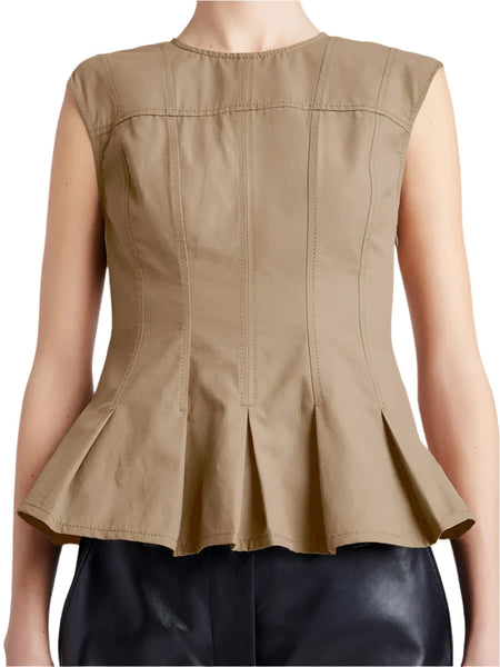 A person wearing a sleeveless, beige Proenza Schouler Felix Top featuring an A-line silhouette, paired with black pants.