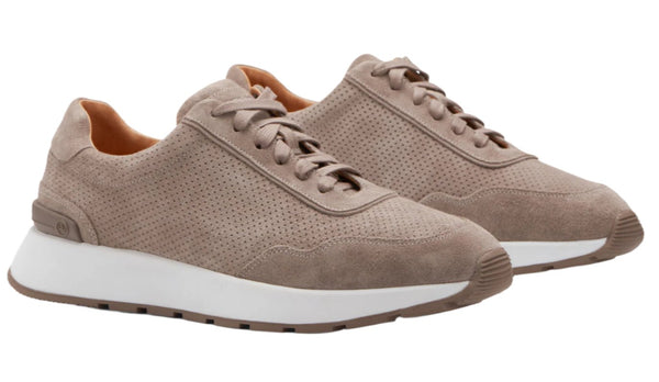 The Peter Millar Wayfare Runner is a pair of vintage runners featuring a light brown suede upper, white soles, and perforated details for added style.