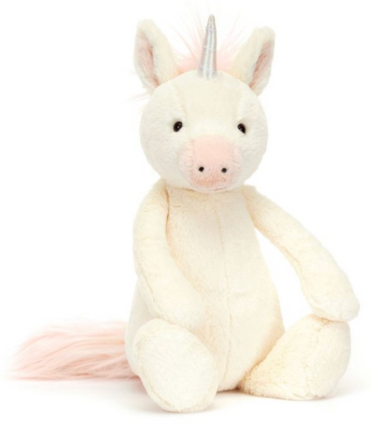 A Jellycat Bashful Unicorn, Medium with soft vanilla fur, a pink nose and ears, a holographic horn on its forehead, and a pink mane and tail, sitting upright.