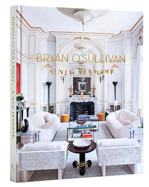 Bryan O'Sullivan: A New Glamour," by acclaimed interior designer Bryan O'Sullivan, explores modern and historical influences in luxurious living. The cover showcases an ornate living room with elegant furniture and light-toned decor, perfectly capturing the essence of his sophisticated style. Published by Rizzoli.