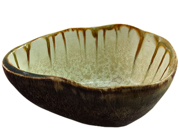 A AE Ceramics footed sauce bowl with a brown drip glaze design.