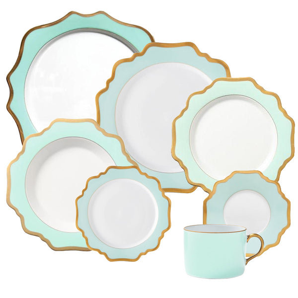 The Anna Weatherley Anna's Palette Aqua Green Collection by Anna Weatherley is a matching set of mint green and white pieces, featuring hand-painted scalloped edges with a brushed gold outline. This elegant collection includes plates of various sizes and a cup, perfect for any dining occasion.