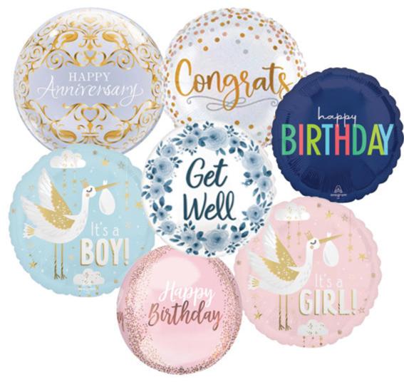 Image of Burton+Burton's Signature Balloon collection featuring assorted occasion messages like "Happy Anniversary," "Congrats," "Get Well," "Happy Birthday," "It's a Boy!" and "It's a Girl!" in various colors and designs, perfect for pairing with floral arrangements. Local delivery available.