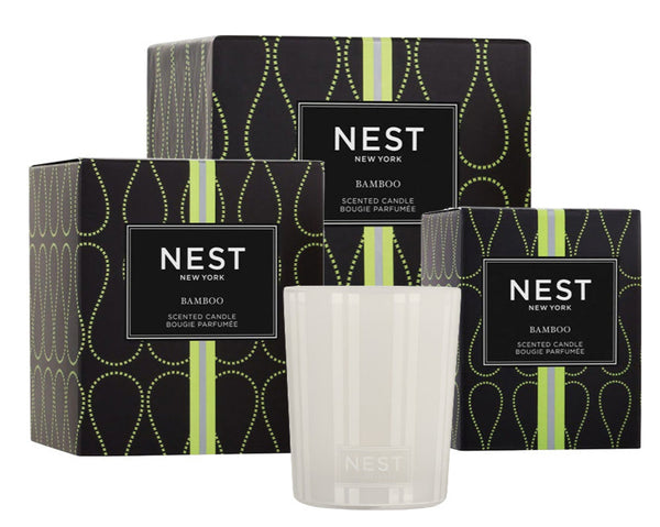 The NEST Bamboo Candle Collection from Nest includes three premium bamboo-scented candles: two in elegant black and green boxes and one beautifully unboxed.