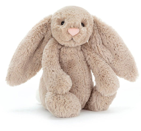 A Jellycat Bashful Bunny Beige, Medium with Jellycat fur, this light brown plush bunny features floppy ears and a pink nose, sitting upright on a white background. It's the perfect gift for any occasion.