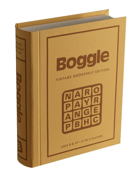 A yellow, book-shaped box featuring "Boggle" and a letter grid on the cover. The text reads "Boggle Vintage Bookshelf Edition" and “Ages 8 & Up • 2 to 6 Players." This classic from WS Game Company, reminiscent of the vintage BOGGLE 1976 edition, adds nostalgic charm to any collection.