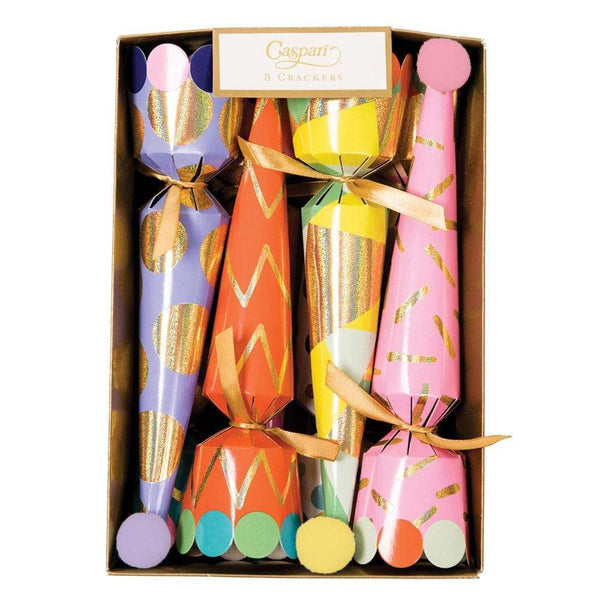 Featuring a boxed set of six Caspari Party Hat Crackers, these items blend pastel and vibrant hues with sparkling gold accents and cute pom-poms on their ends. Perfect for adding festive surprises to any celebration, these crackers from the Caspari brand are sure to delight.