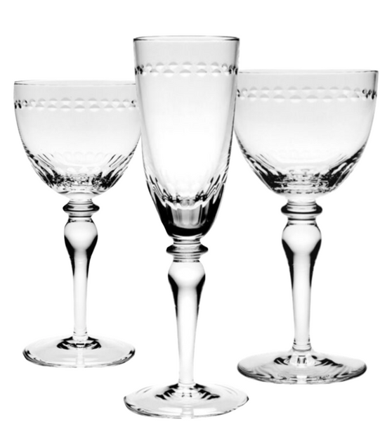 Three stylish glasses from the William Yeoward Crystal Claire Collection, intricately designed with the handmade Camilla shape, feature tall, slender stems and are displayed against a white background.