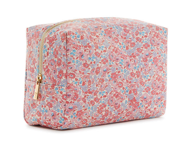 The TRVL Design's TRVL LUXE Everyday Cosmetic Bag, Marseille, is a rectangular vegan leather pouch with a gold zipper and floral pattern featuring red, pink, and blue flowers—ideal for stylishly storing your essentials.