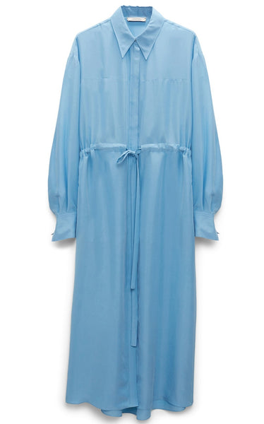 Dorothee Schumacher Heritage Ease Dress by Dorothee Schumacher, a light blue long-sleeve dress with a collared neckline and adjustable waist tie, crafted from 100% silk, hanging on a white background.