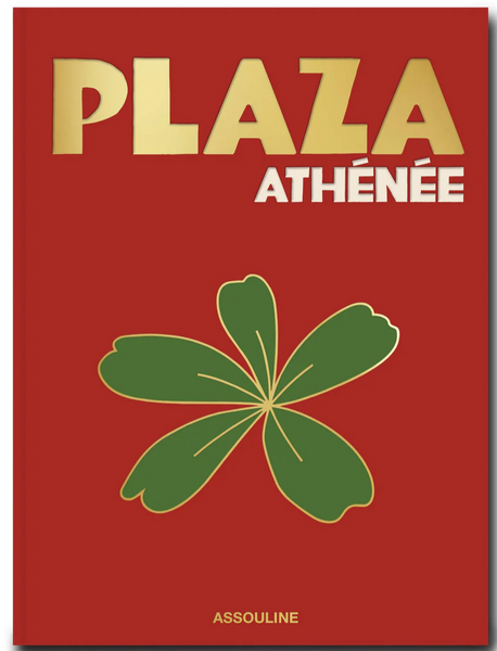 Cover of a red book titled "Plaza Athenee" with a gold and white font. The cover features a green leaf illustration and "Assouline" at the bottom, highlighting the essence of French hospitality and the culinary touch of Jean Imbert.