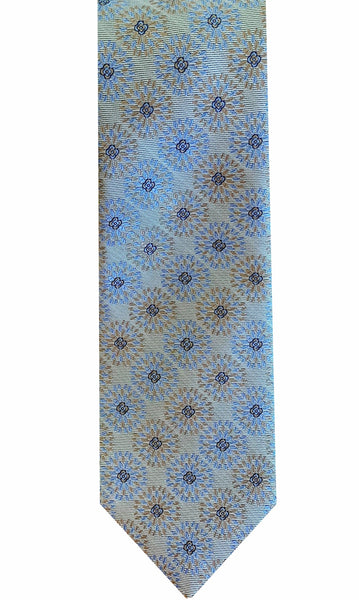 A close-up of the Robert Jensen Dandelion Pattern Tie, a handcrafted light blue necktie featuring a sophisticated repeating pattern of small dark blue and beige floral motifs, showcasing impeccable personal style crafted by traditional artisans from Robert Jensen.