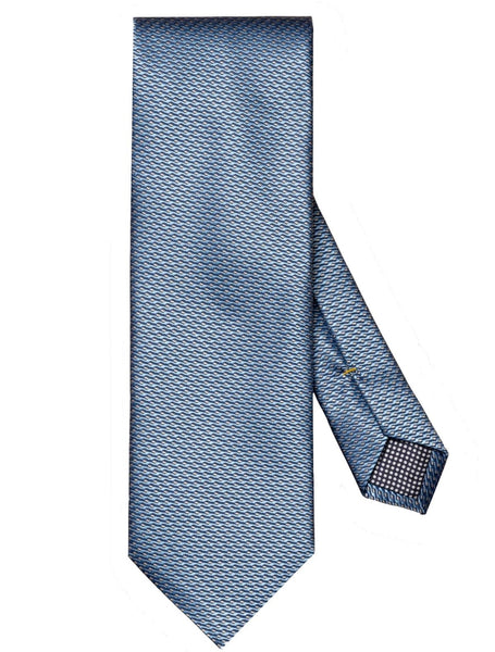 The Eton Blue Geometric Silk Tie, featuring a subtle geometric pattern in blue with a small gold accent on the tail end, crafted from 100% silk by Eton, is displayed against a white background.