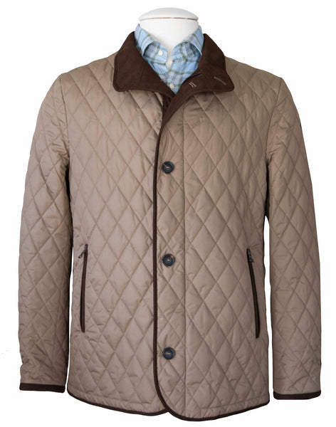 A Waterville Dem Quilted Nylon Jacket in beige, adorned with a dark brown collar and equipped with button closures and two pockets, showcased on a mannequin wearing a light blue checkered shirt.