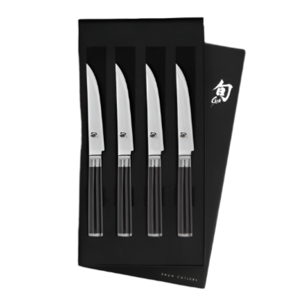 Discover the elegance of the Shun Classic Ebony Steak Knife Set, featuring four razor-sharp stainless steel steak knives with sleek black handles, all beautifully arranged in a sophisticated black box.