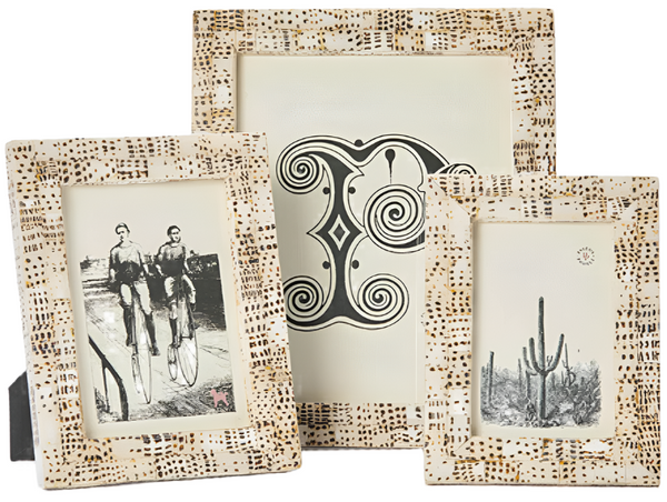 Three patterned picture frames from the Pigeon and Poodle Mombasa Frame Collection: the largest contains abstract artwork behind clear smooth resin, while the smaller two feature illustrations of cyclists and a cactus.