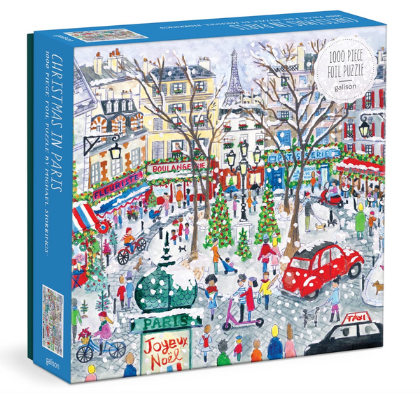 The Michael Storrings Christmas in Paris 1000 Piece Puzzle by Chronicle Books beautifully captures the enchanting essence of Christmas in Paris, featuring delightful shops, festive trees, and joyful people.