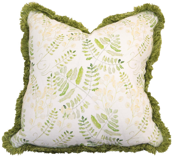 Handmade square throw pillow with a white fabric adorned with a green fern pattern, framed by green fringe trim. This exquisite Fern Yellow Pillow by Associated Design is crafted with care in the USA.