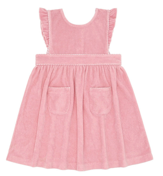 The Minnow French Terry Pinafore Dress by Minnow is a pink, sleeveless garment with ruffle sleeves, crafted from soft French terry fabric and featuring two front pockets.