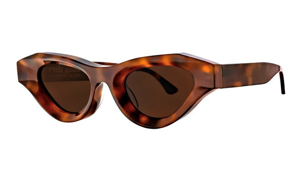 A pair of Thierry Lasry Jaya Sunglasses with dark lenses and a thick, angular frame, adding a touch of Thierry Lasry's distinctive style to any eyewear collection.