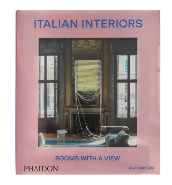 Cover of the book "Italian Interiors: Rooms with a View" by Laura May Todd, published by Phaidon, featuring the elegance of Italian interior design through a sophisticated room with a window view.