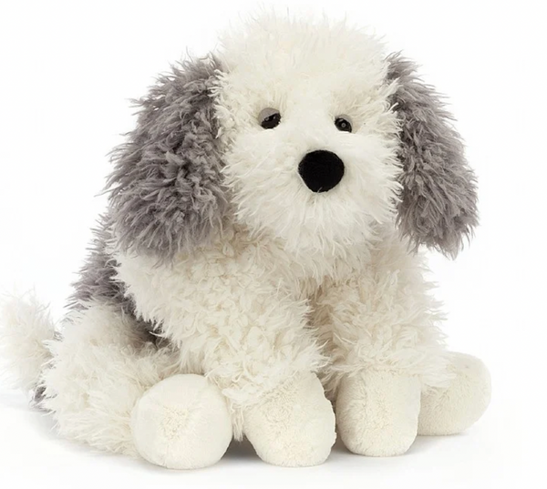 A Jellycat Floofie Sheepdog from Jellycat with white and gray fur, reminiscent of a tumbling cloud of scruffled softness, is sitting. It features large floppy ears and a black nose.