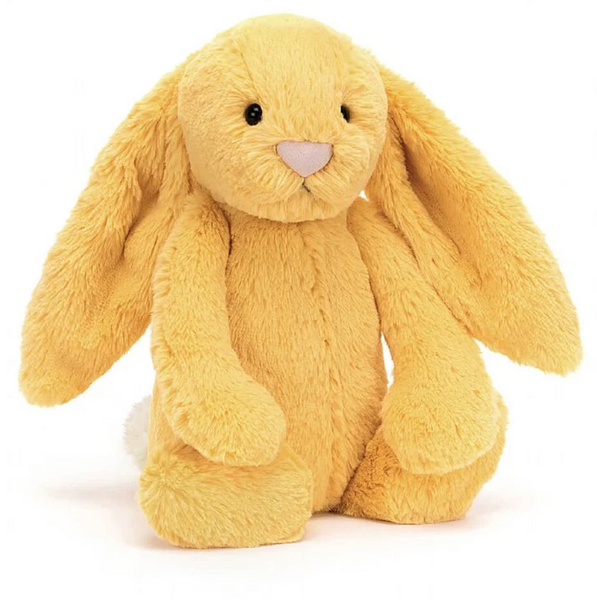 A Jellycat Bashful Sunshine Bunny, Medium, with long floppy ears sits upright, a soft and timeless gift in a charming, yellow plush.